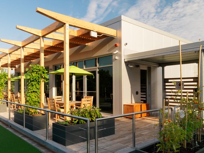 Rooftop deck with modern room and arbor