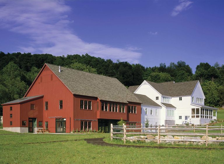 Re-purposed white farmhouse with red barn