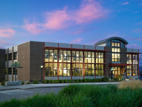 Contemporary masonry building with wood sun shades