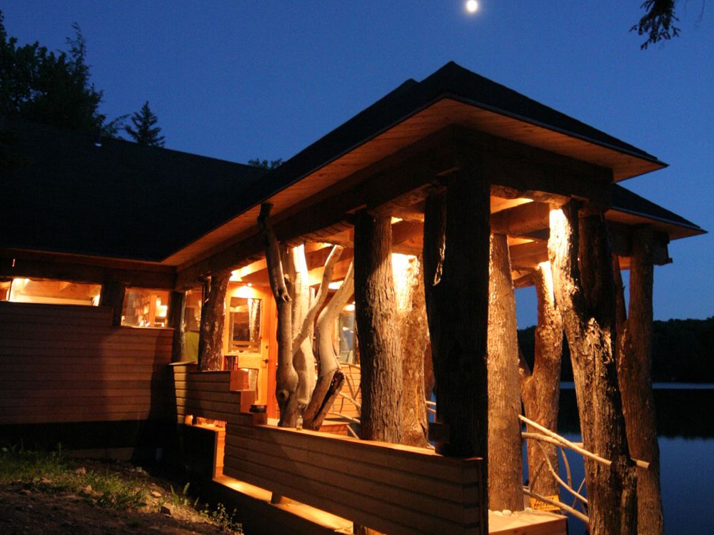 Rustic entry with tree trunk columns