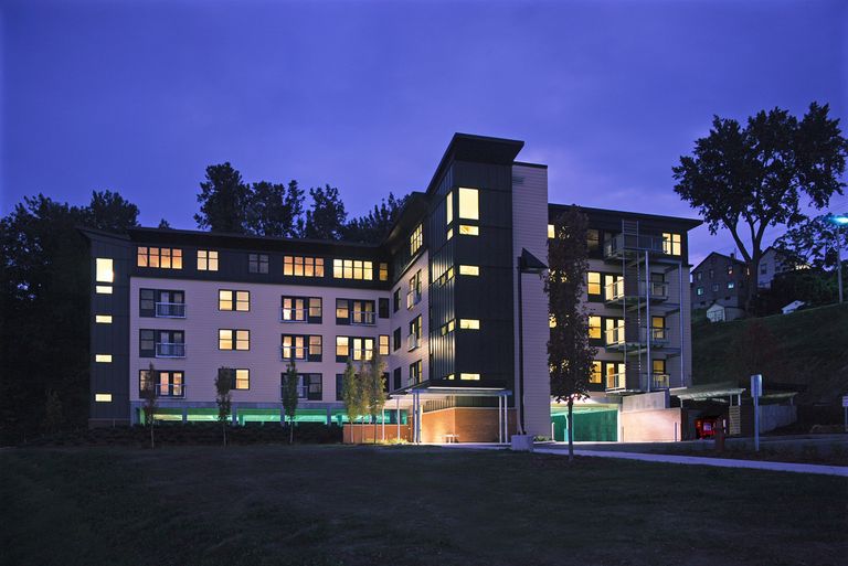 Contemporary multistory apartment building at night