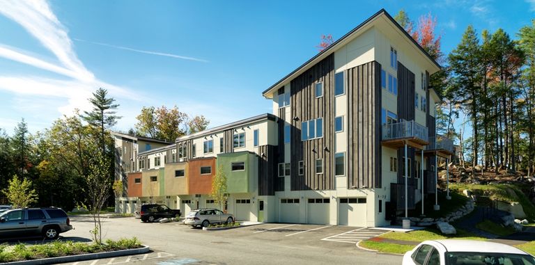 natural wood and colored panels on a multistory building