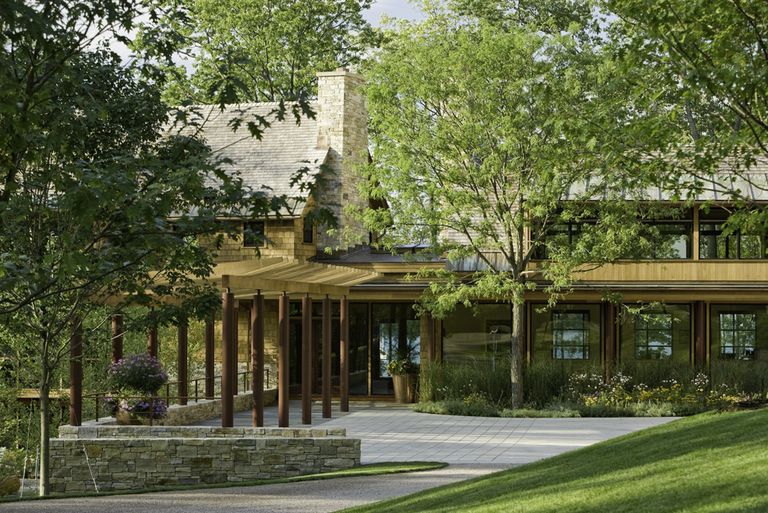 natural wood sided and arbor in wooded site