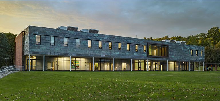 long 2-story masonry building with recessed glazed walk atlower story