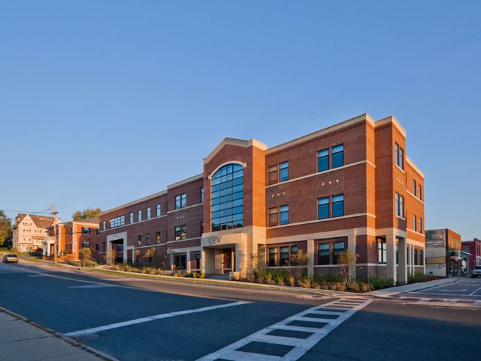 Contemporary brick urban building on sloping lot