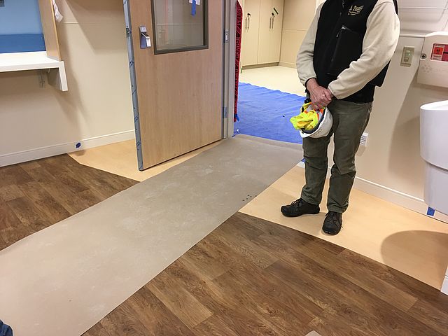 two different types of wood floor in a patient room